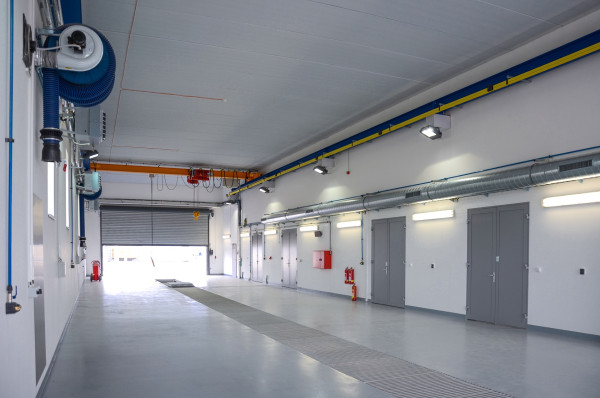 Tanker service facilities with assembly pit and crane track
